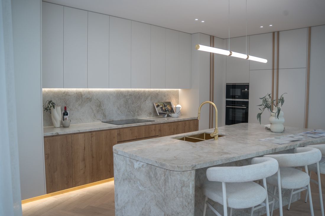 Custom kitchen with timber cabinetry and stone island bench