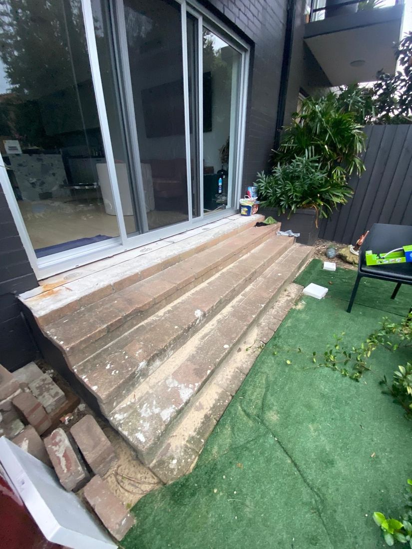 The old timber steps outside the sliding doors before the work began